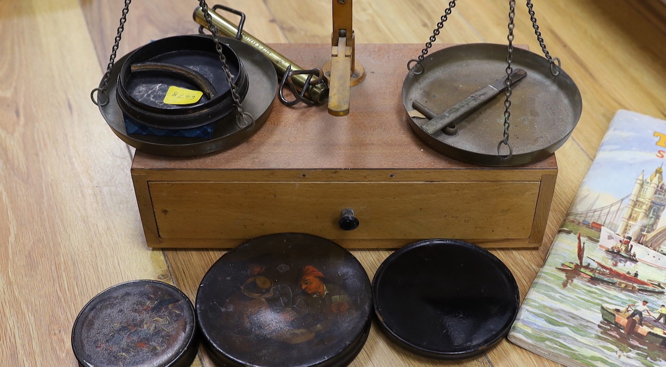 A quantity of various weighing scales, pots and prints